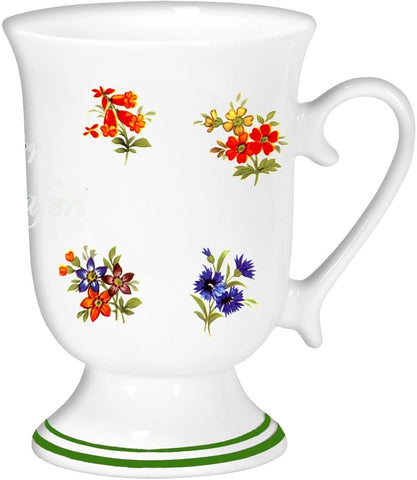 Taza de porcelana, cafetera y taza de cacao con motivos florales en bordes de colores 