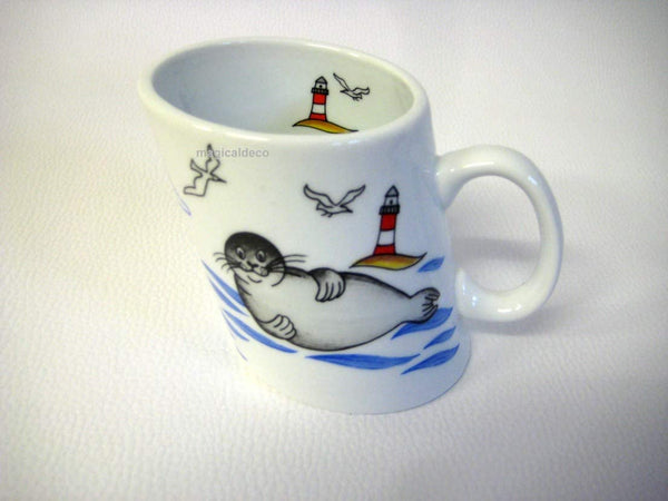 Porzellan- Tasse, Kaffeepott, Becher - Seehund Leuchtturm - maritim -deutsches Produktdesign